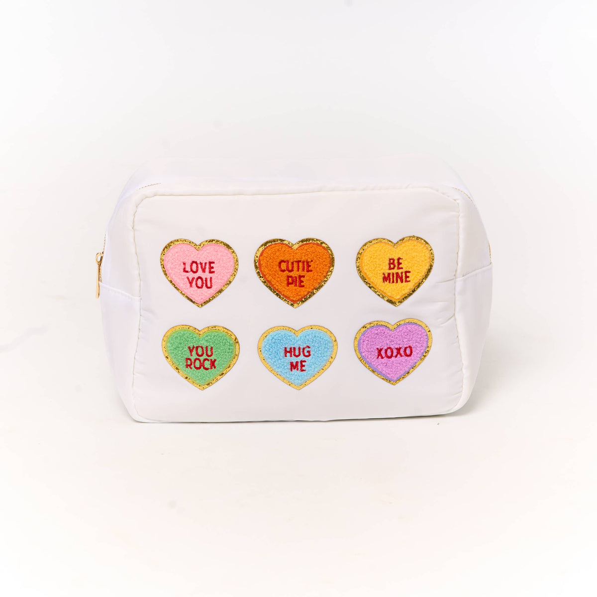 Large white cosmetic bag with six colorful glittery heart patches featuring romantic phrases for valentines day