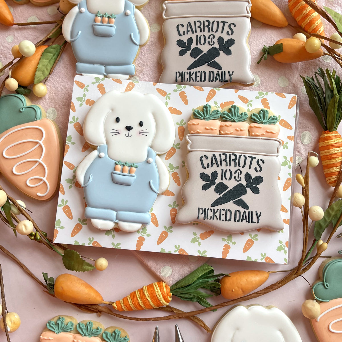 Bunny farmer cookie cutter bundle featuring a white bunny cookie with light blue overalls and a carrot basket design
