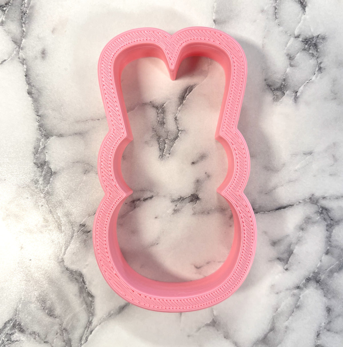 Pink bunny peep flour box cookie cutter with textured ridged edge for baking and decorating cookies