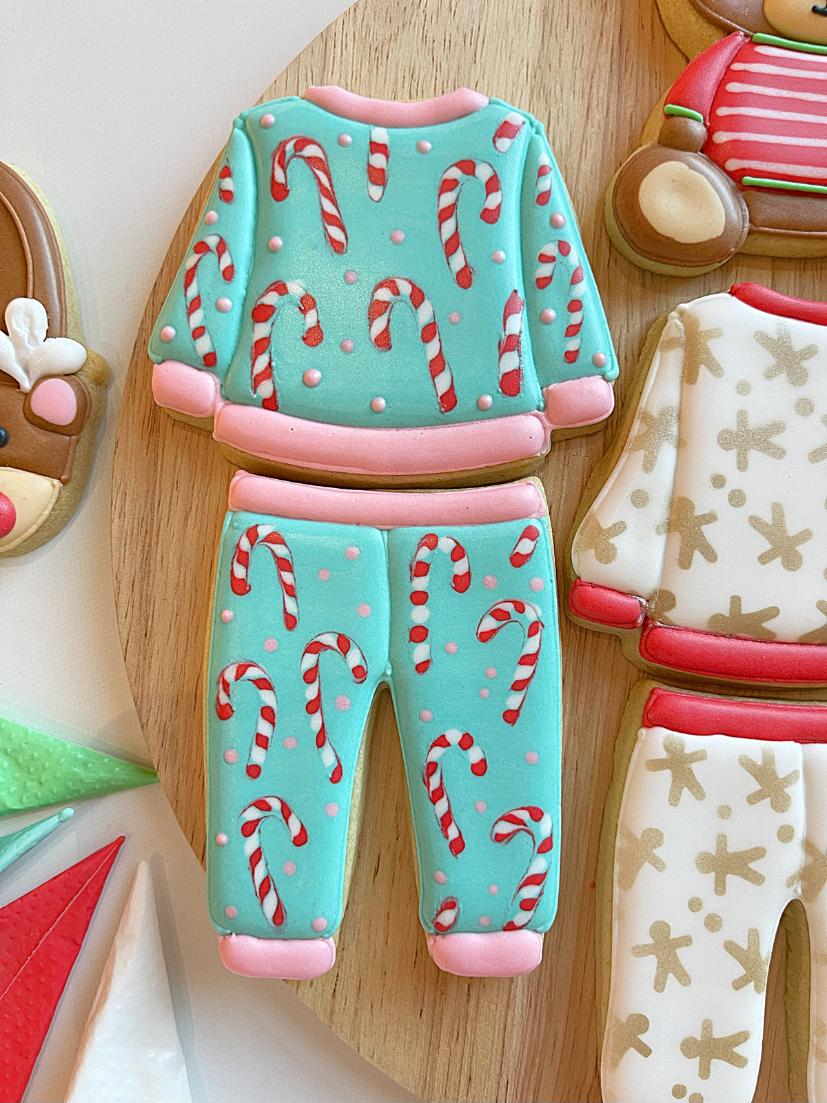 Turquoise sugar cookie pajama top and bottom cutter set with red white candy cane patterns and pink trim