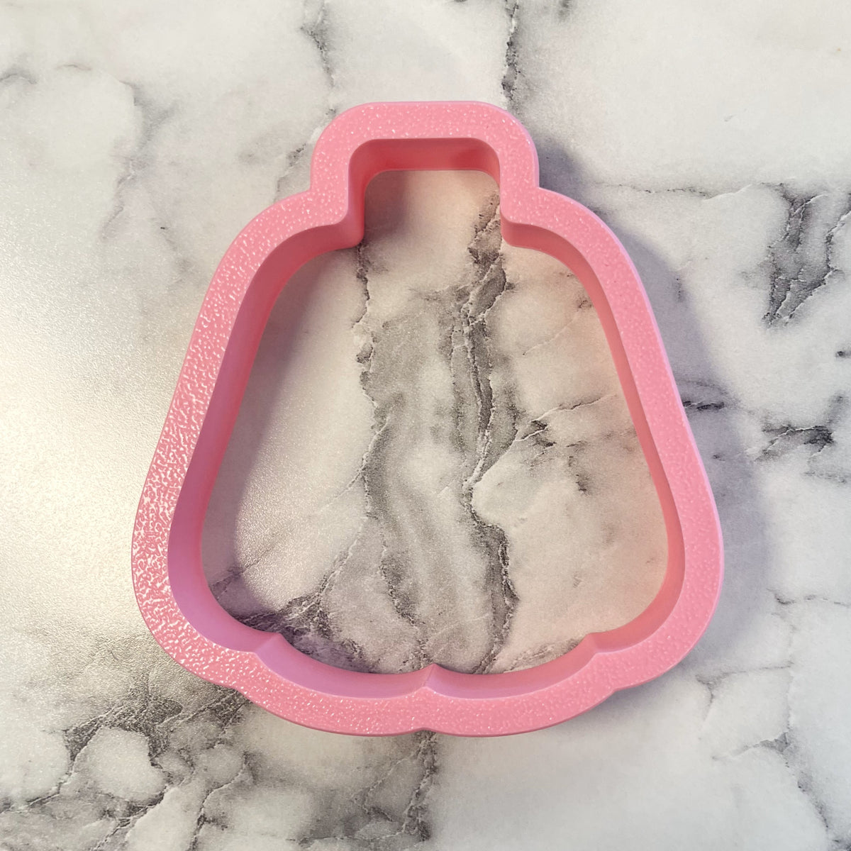 Pink glittery silicone dress-shaped cookie cutter from candy pumpkin flour box club for baking and crafting
