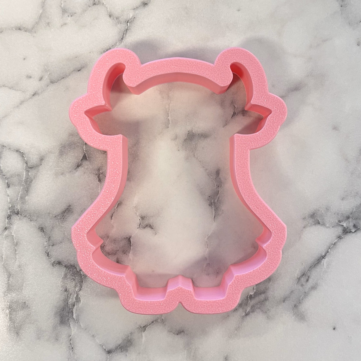 Pink glittery silicone cookie cutter shaped like a deer head for western ghost highlander cow cookies