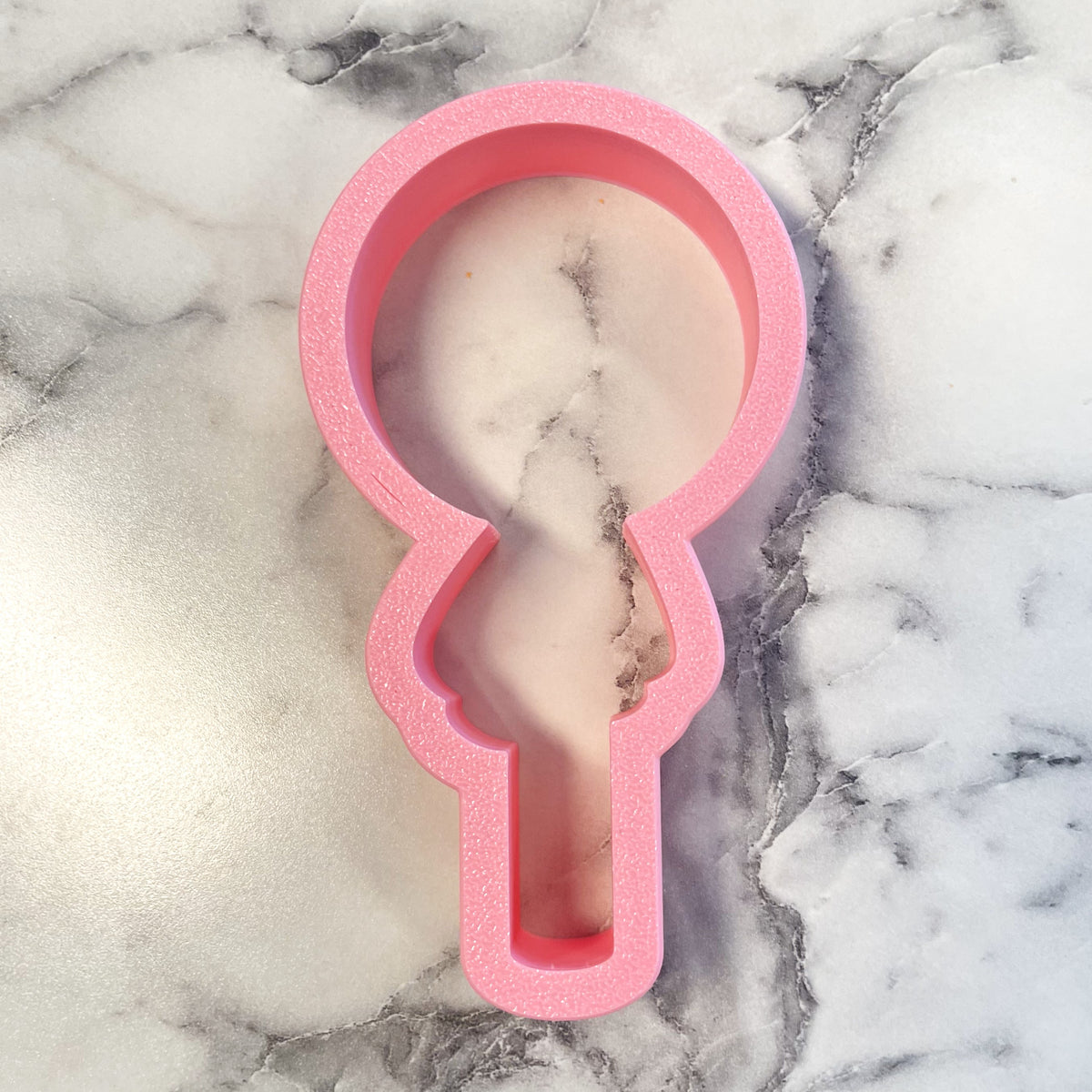 Pink silicone key-shaped cookie cutter from ghost lollipop flour box club for baking and crafting