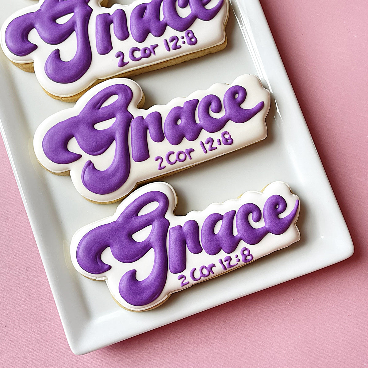 Faith cookie cutter bundle features purple and white sugar cookies shaped like grace with 2 corinthians 12 8 verse