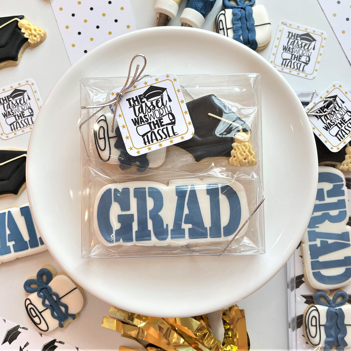Blue and white mini grad cap cookie with icing design packaged in clear cellophane for flour box club use