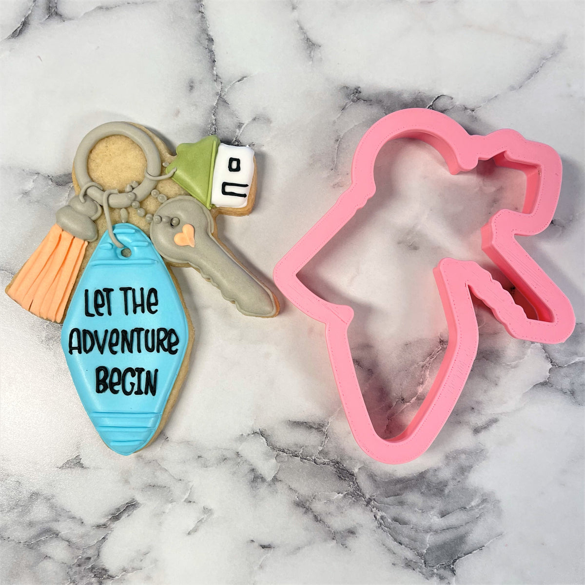 Pink silicone keychain cookie cutter shaped like a person in a dress for housewarming key ring gifts
