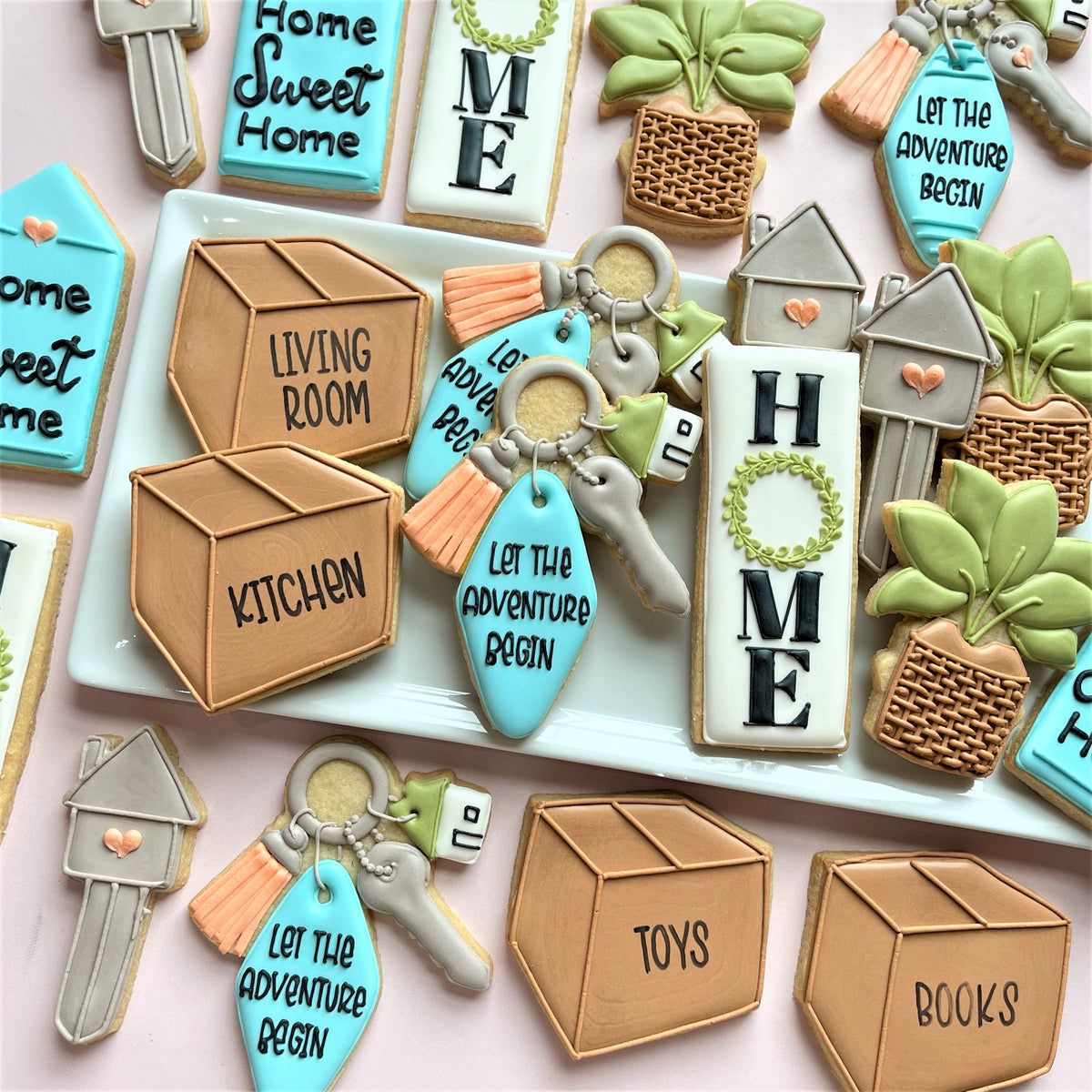 Blue and white let the adventure begin keychain cookie with silver key attached housewarming key ring cookie cutter