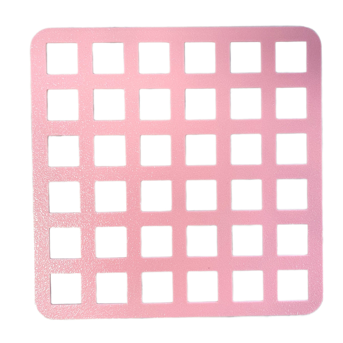 Pink square large sprinkle stencil mat with evenly spaced cut-out squares for baking decoration