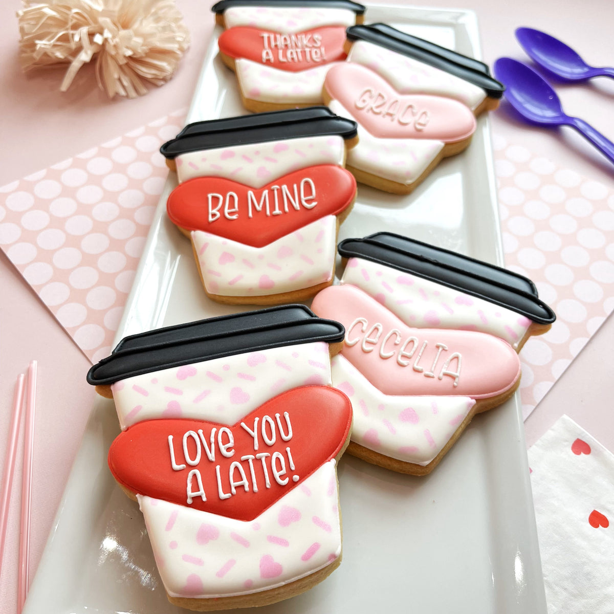Valentine’s day latte heart cookie cutter bundle sugar cookies shaped like coffee cups with pink white icing and red hearts