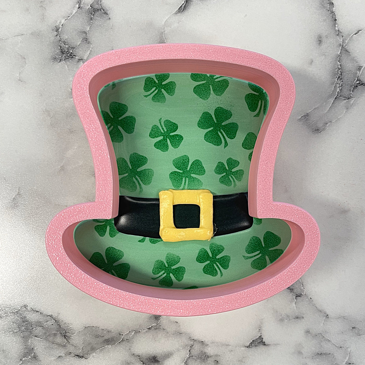 Pink glittery classic leprechaun top hat cookie cutter made of durable material for festive baking and crafts