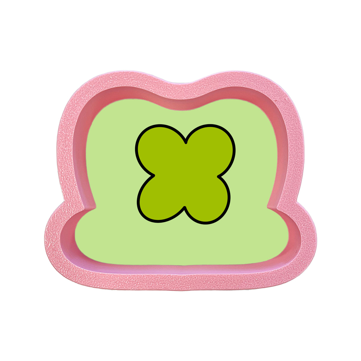 Mini marshmallow hat cookie cutter in pink glittery silicone with lime green center and black outline for baking