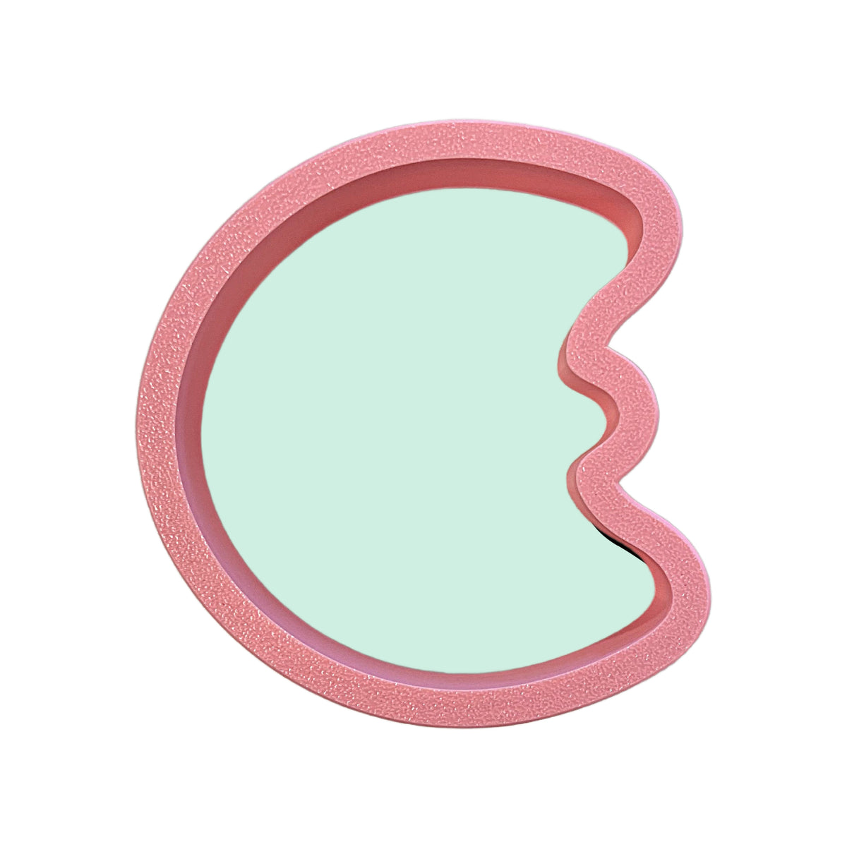 Mini marshmallow moon cookie cutter in pink glittery metal with a light mint green interior for baking use