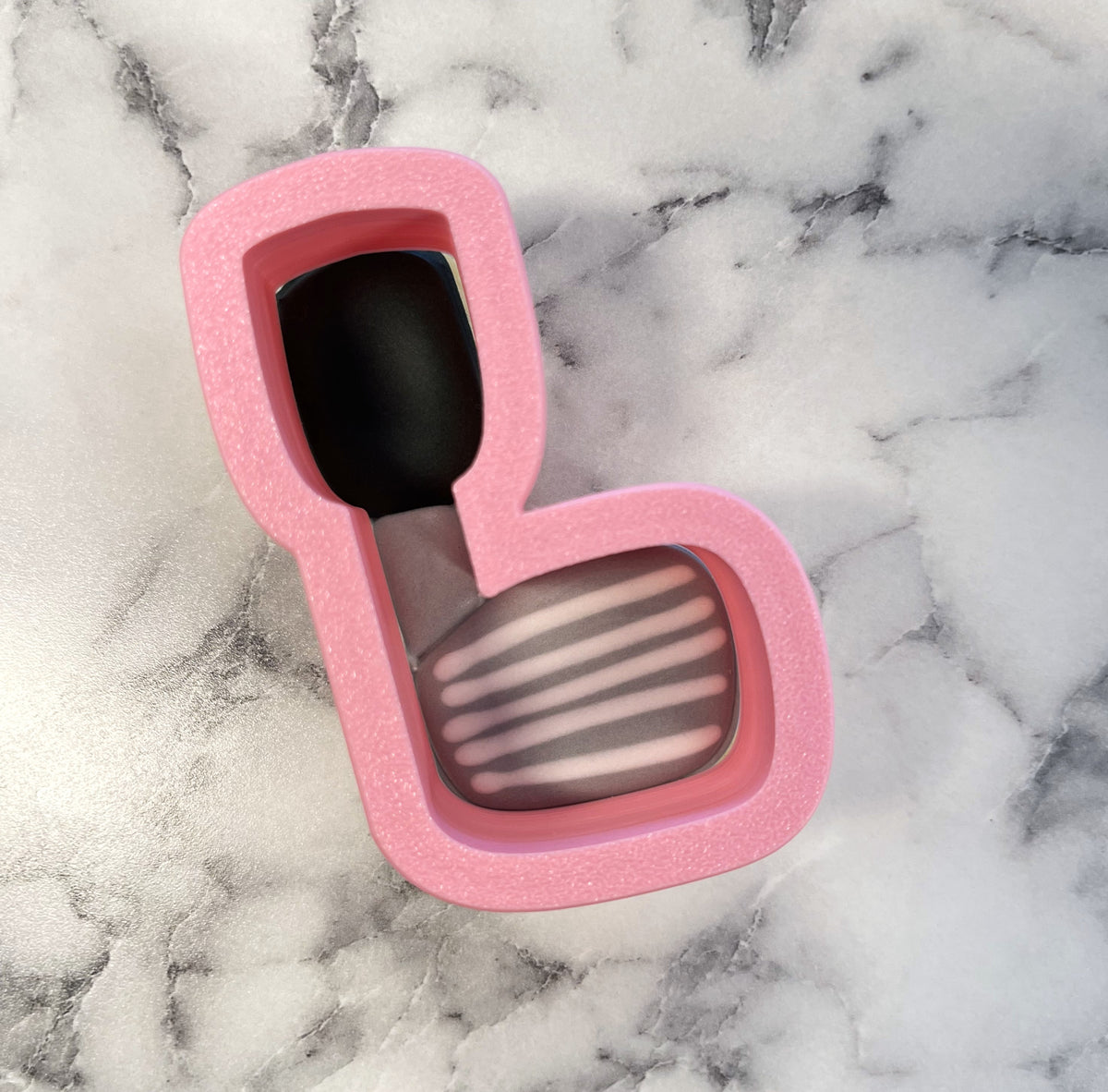 Pink glittery silicone mini golf club cookie cutter shaped like sunglasses for decorative baking use