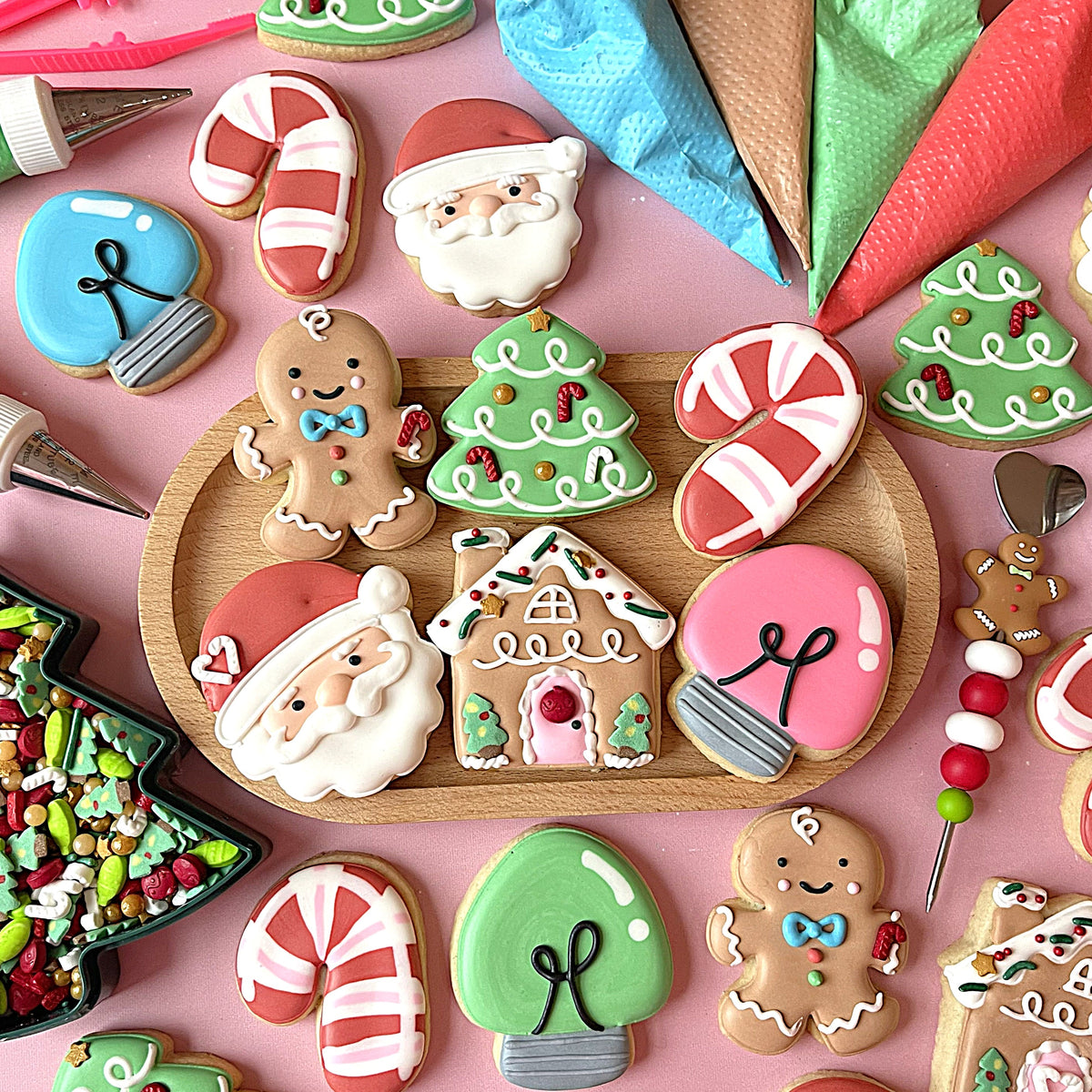 A festive gingerbread man cookie with a light brown base white icing details and a small blue bow tie from mini cute christmas cookie decorating kit