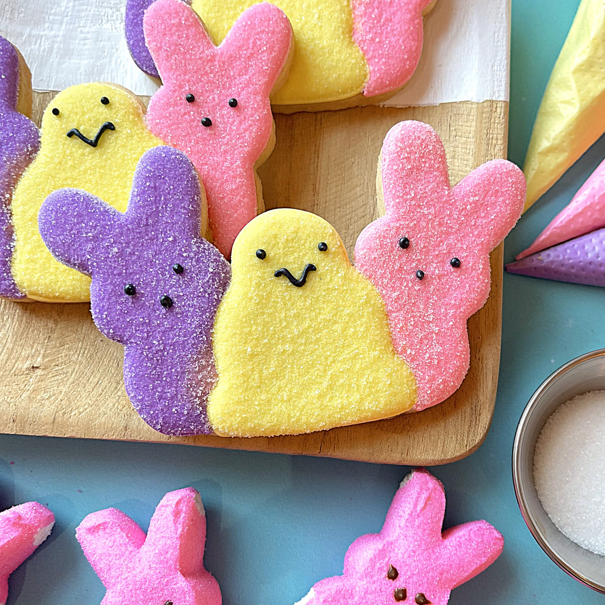 Pastel-colored sugar-coated peeps marshmallow bunnies in pink yellow and purple for easter sweets online class recording