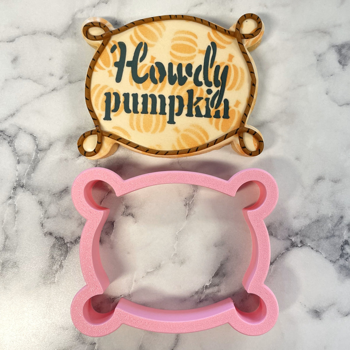 Pink bear-shaped western plaque with loops cookie cutter with stencil made of durable food-safe material