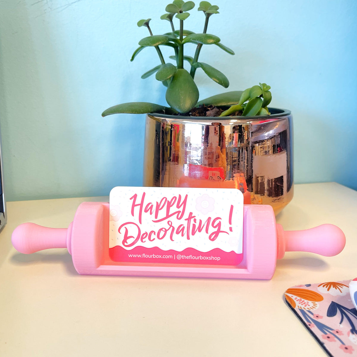 Pink silicone rolling pin with happy decorating card attached shown as pink flour box rolling pin business card holder