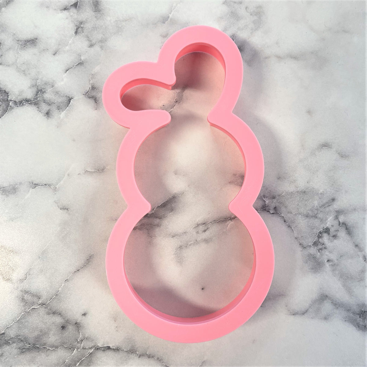 Pink silicone bunny shaped cookie cutter from bunny roly poly flour box club for baking and crafting