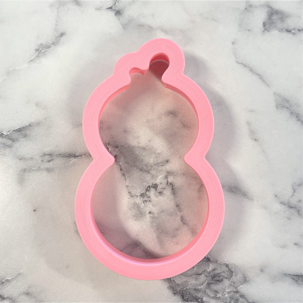 Pink silicone gourd shaped mold from Chick Roly Poly Flour Box Club cookie cutter set for baking and shaping dough