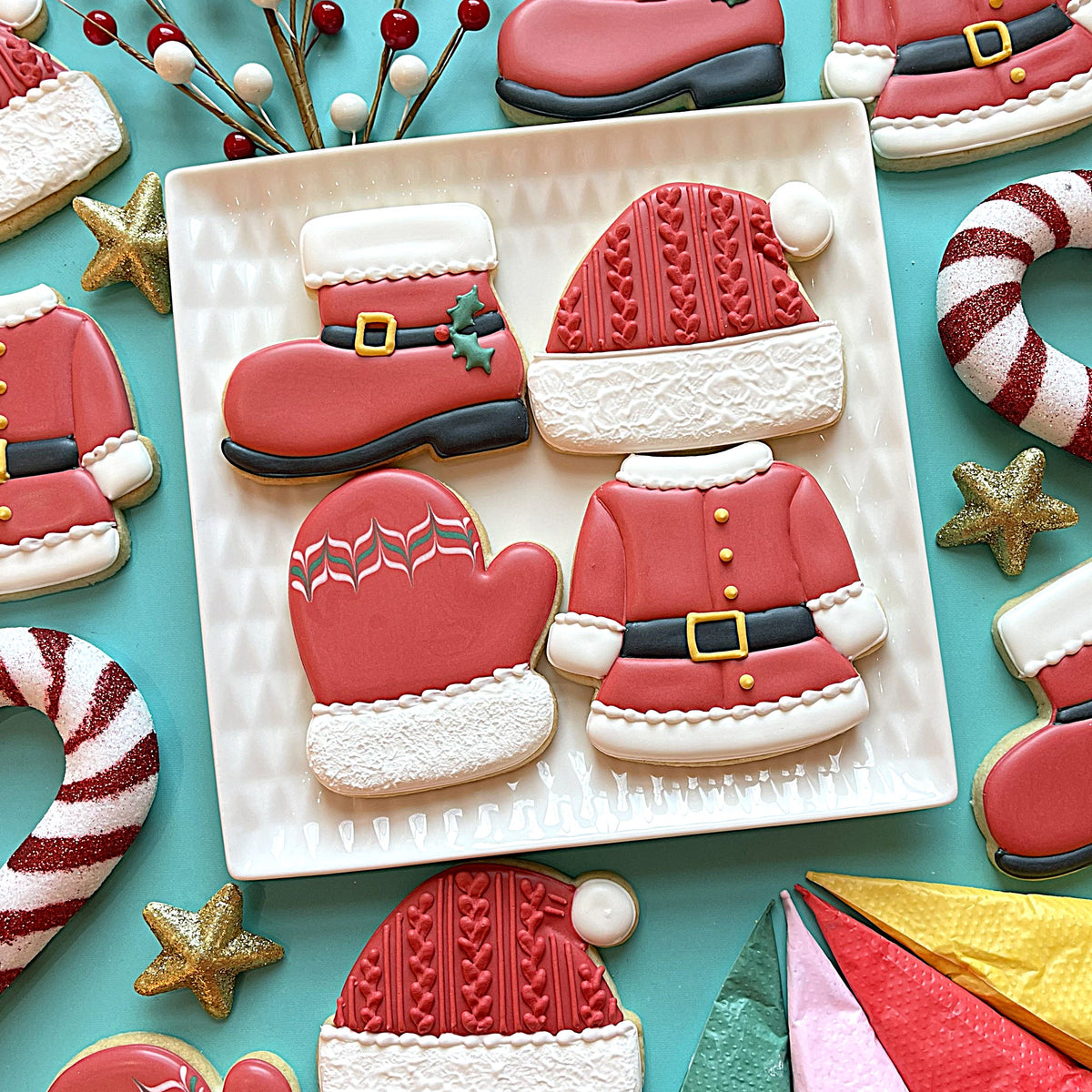Santa’s Boot Flour Box Club cookie cutter set with red and white santa-themed sugar cookies shaped like boot hat mittens and coat