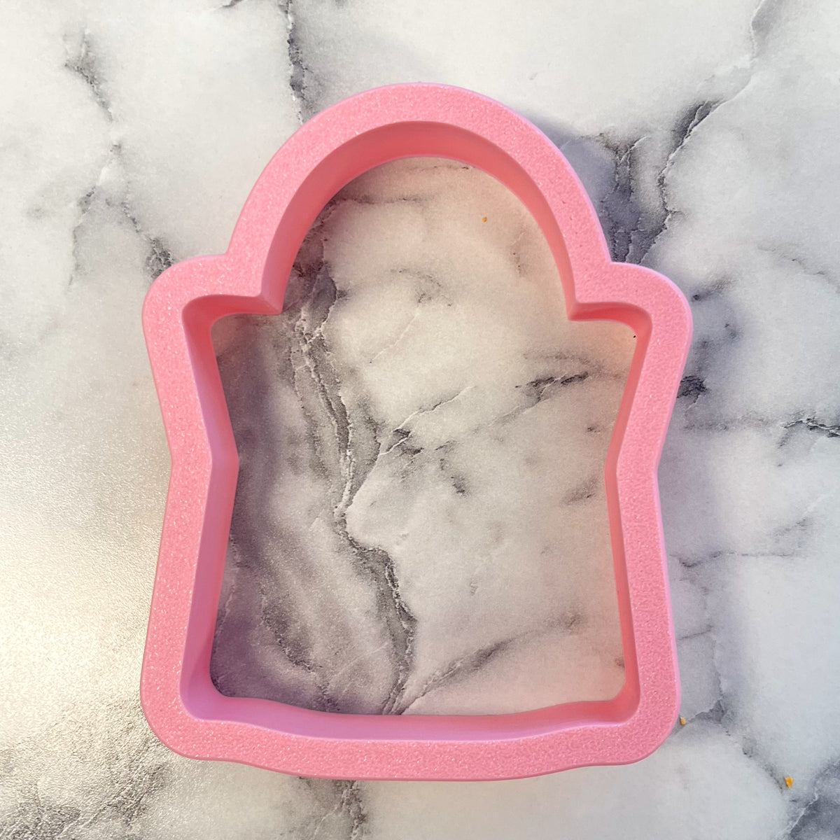 Pink silicone tombstone shaped cookie cutter from treat bag flour box club for baking and decorating cookies
