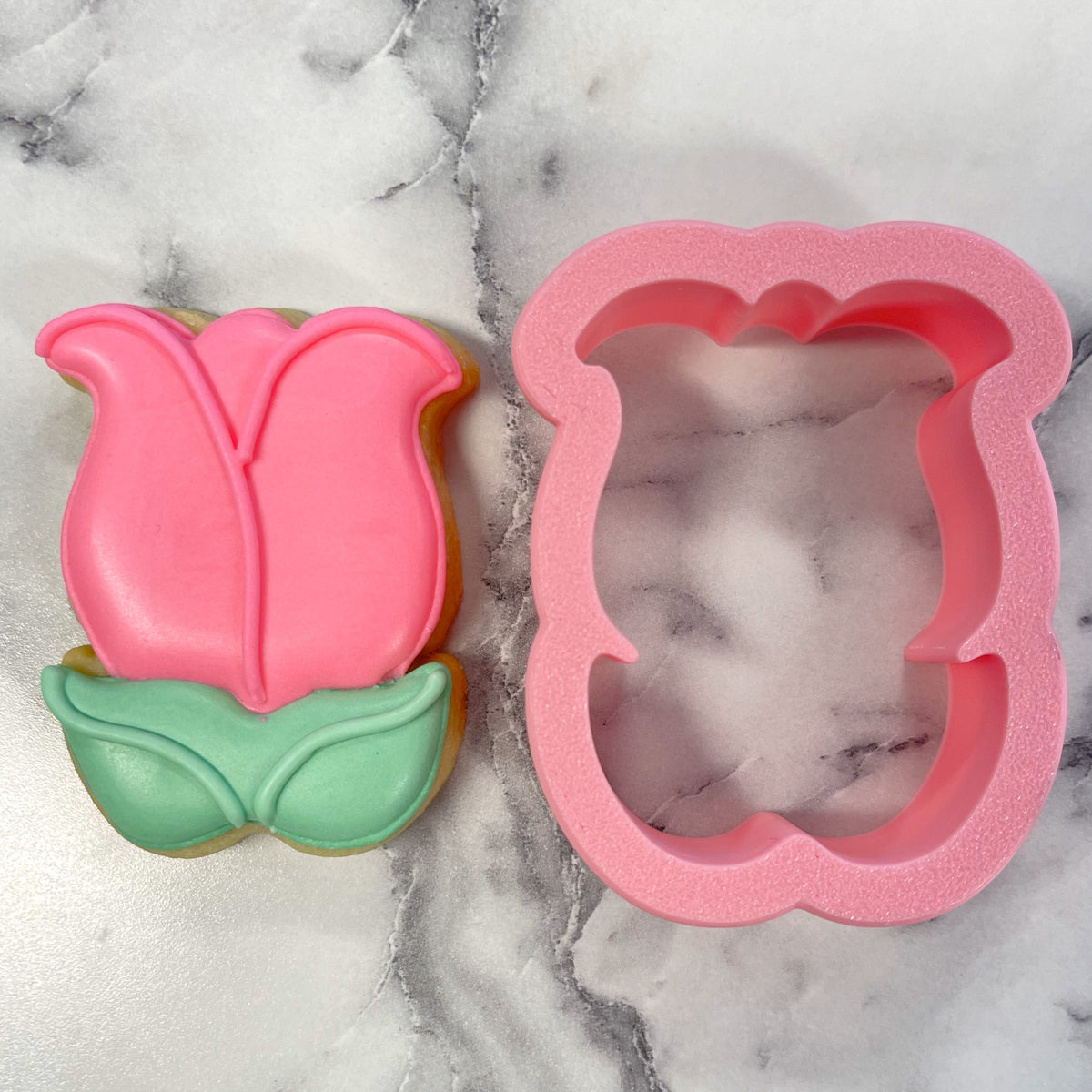 Mini tulip with leaves cookie cutter in pink glittery metal with green leaf accents and matching pink silicone mold