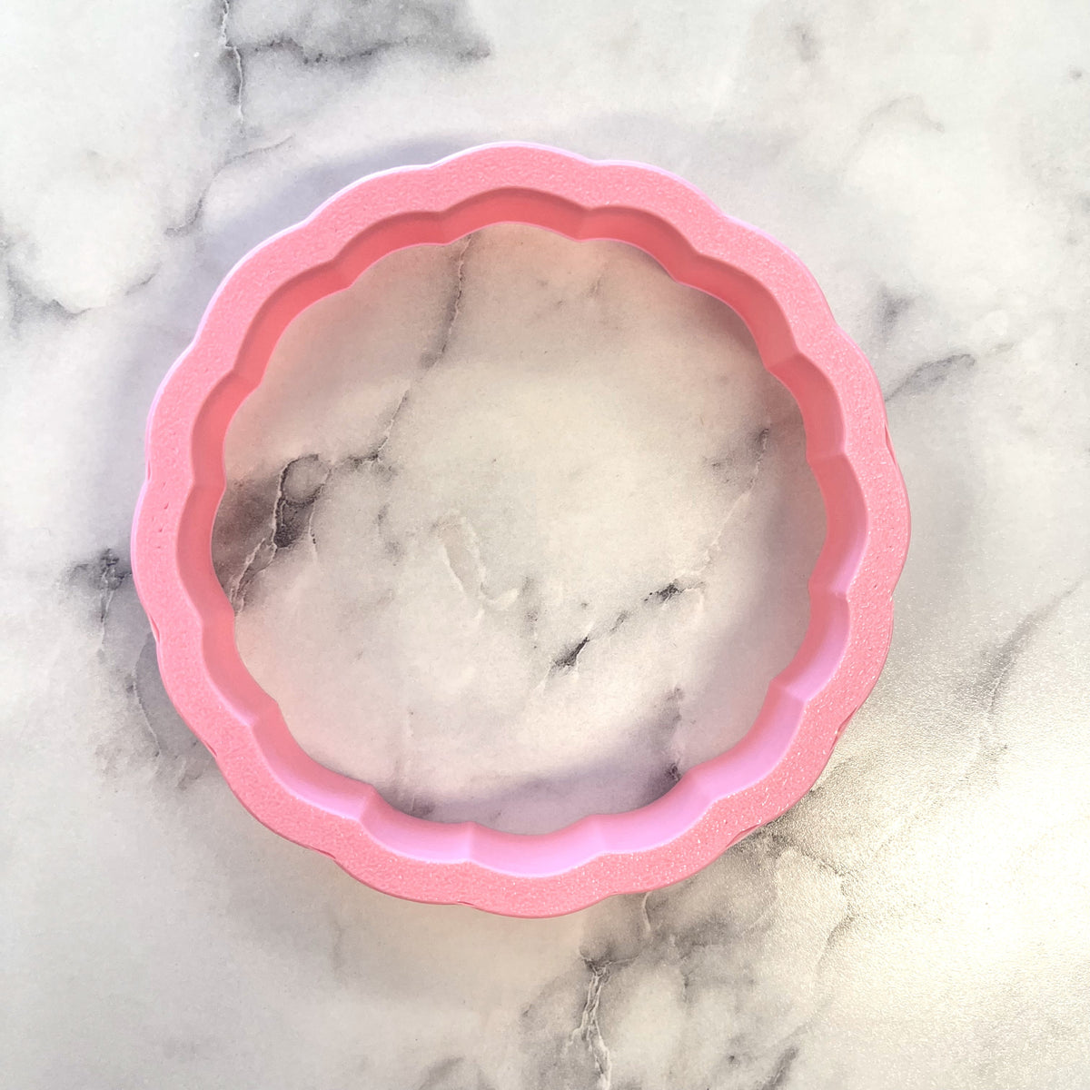 Pink scalloped silicone baking mold with marble-patterned interior for proverbs 31 25 cutter and stencil bundle