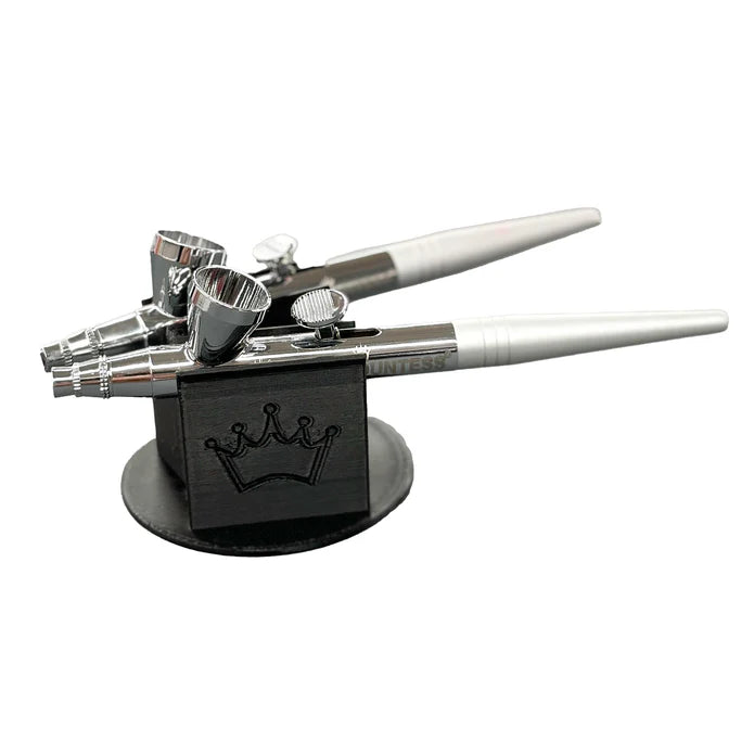 Silver and white airbrush paint sprayer with black crown embossed stand for dual holder cookie countess