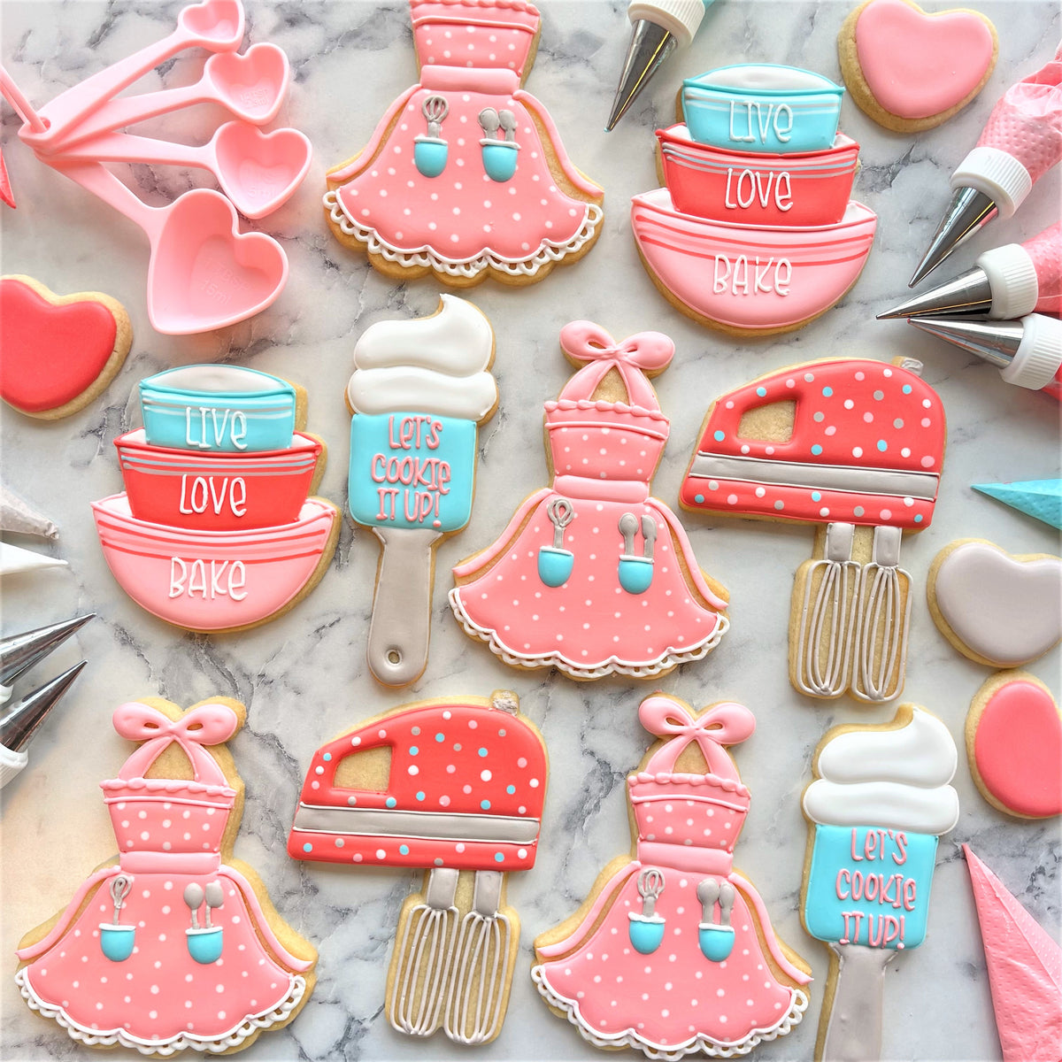 Pink polka dotted apron tutu cookie cutter with blue accents and lace trim for baking and crafting use