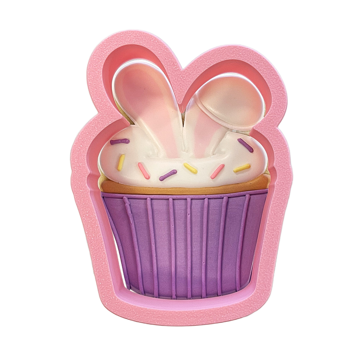 Pink silicone bunny cupcake cookie cutter with ears and colorful sprinkles for baking and decorating