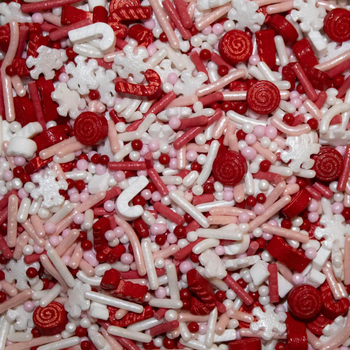 Candy cane sprinkle mix featuring a festive blend of red white and pink glossy candy-shaped sprinkles
