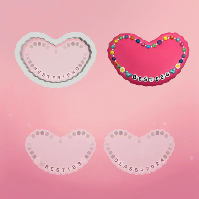 Pink heart shaped friendship bracelet cookie cutter with colorful beaded border and besties text in playful font