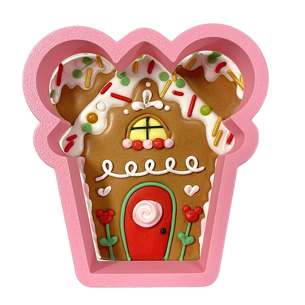 Pink silicone gingerbread mouse house cookie cutter with mickey mouse shape, gingerbread house design, and festive details