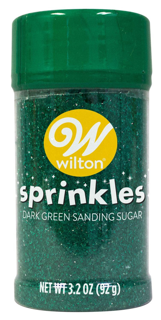 A wilton dark green sanding sugar small sprinkle jar with sparkling granules and a glossy green lid
