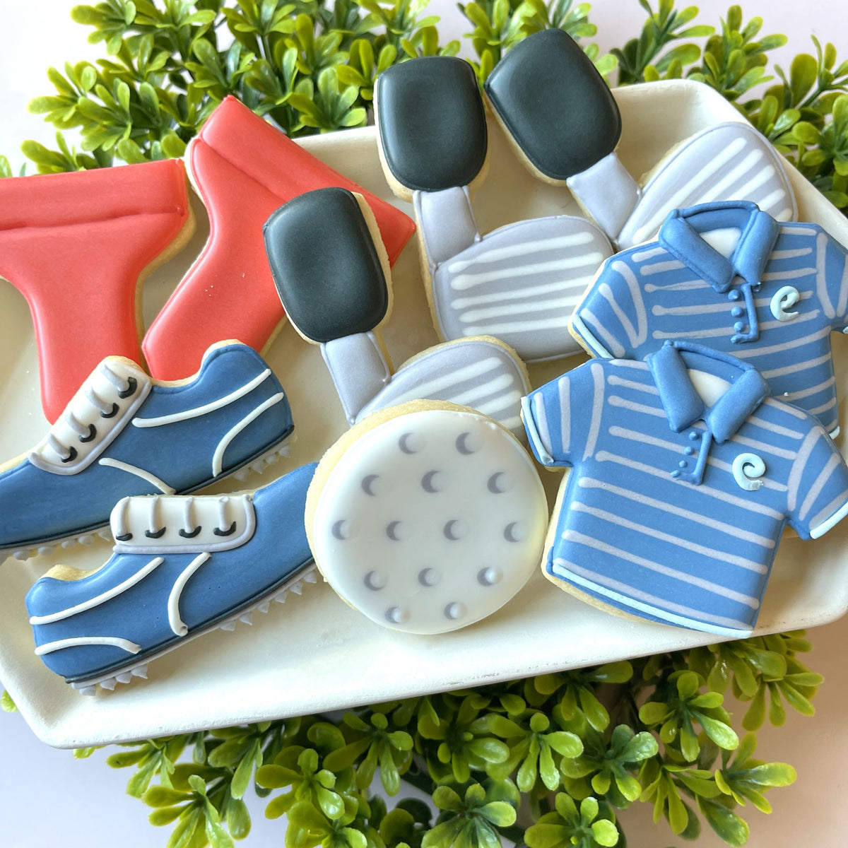 Blue and white striped golf polo shirt cookies with a small embroidered logo on the chest from mini golf 2.0 cookie cutter bundle