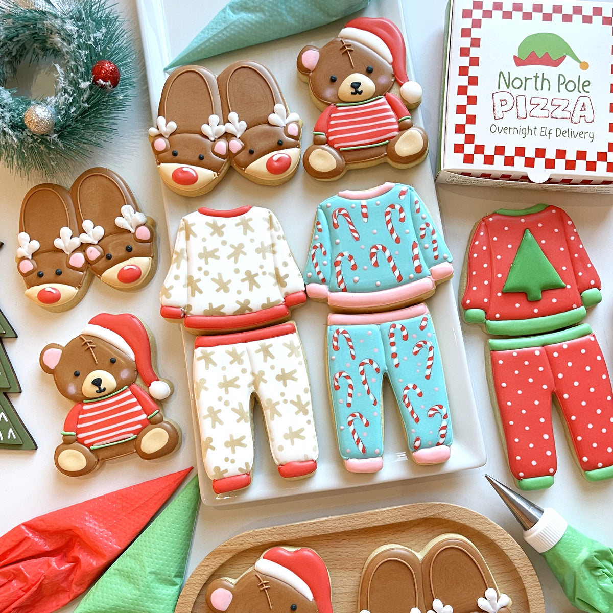 Christmas pajamas cookie cutter bundle with sugar cookies shaped like reindeer teddy bears and candy cane pajamas