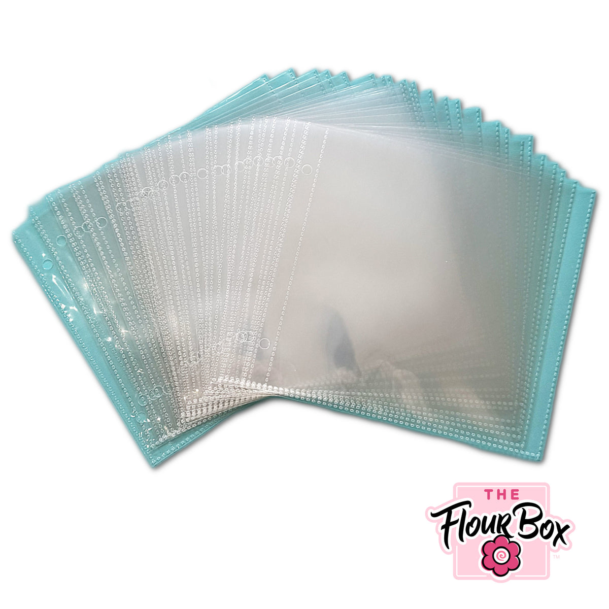 A stack of translucent turquoise plastic stencil sleeve pocket pages with reinforced edges and circular perforations