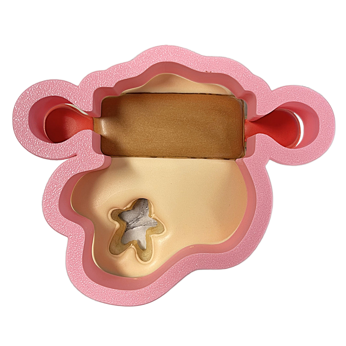 Pink foam bear-shaped cookie cutter with brown rolling pin for rolling dough and cutting gingerbread cookies