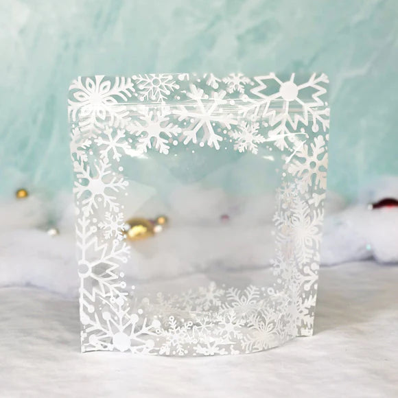 Clear plastic snowflake cookie bag with intricate white snowflake cutout design along the edges 10 bags