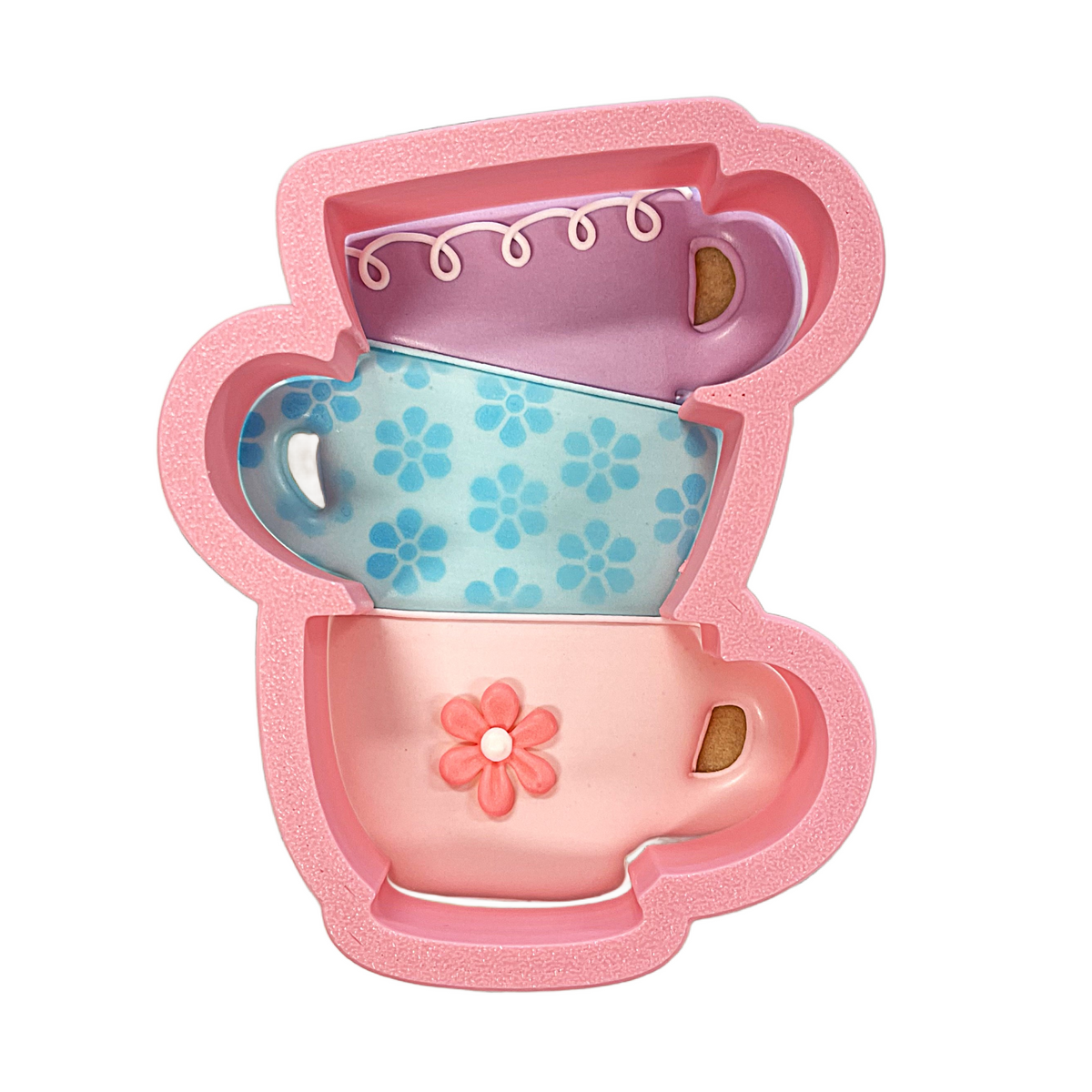 Pink silicone stacked teacups cookie cutter with three pastel colored teacups and decorative patterns for baking