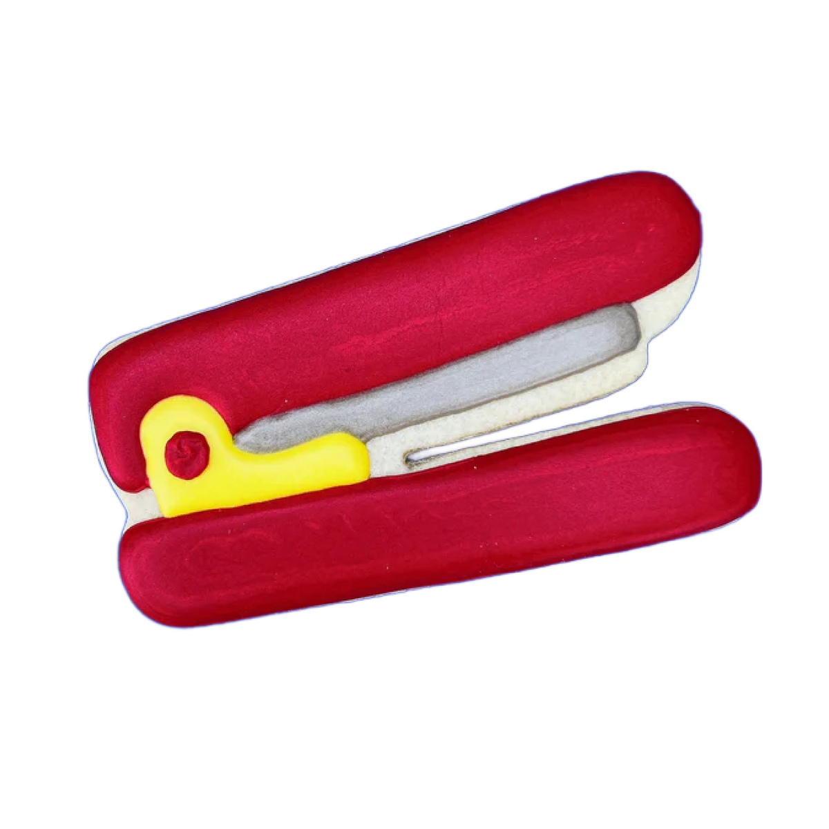 Red and yellow plastic stapler cookie cutter with white interior for baking and crafting use