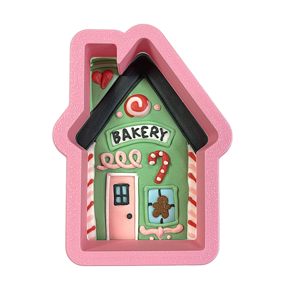 Village bakery cookie cutter pink glittery silicone mold shaped like gingerbread bakery with green walls and candy cane accents