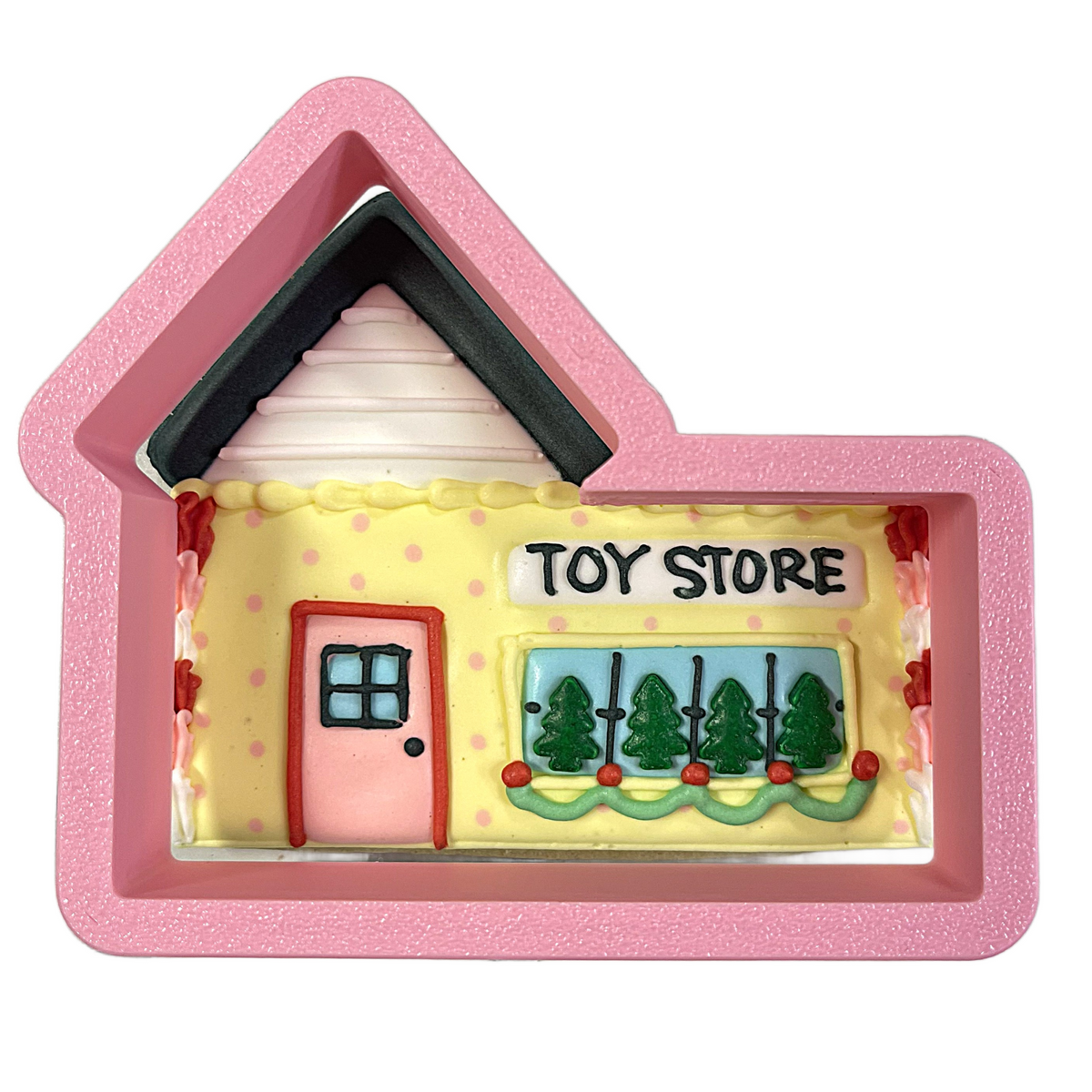 Pink house-shaped village toy store cookie cutter with yellow interior and black roof trim for baking and decorating