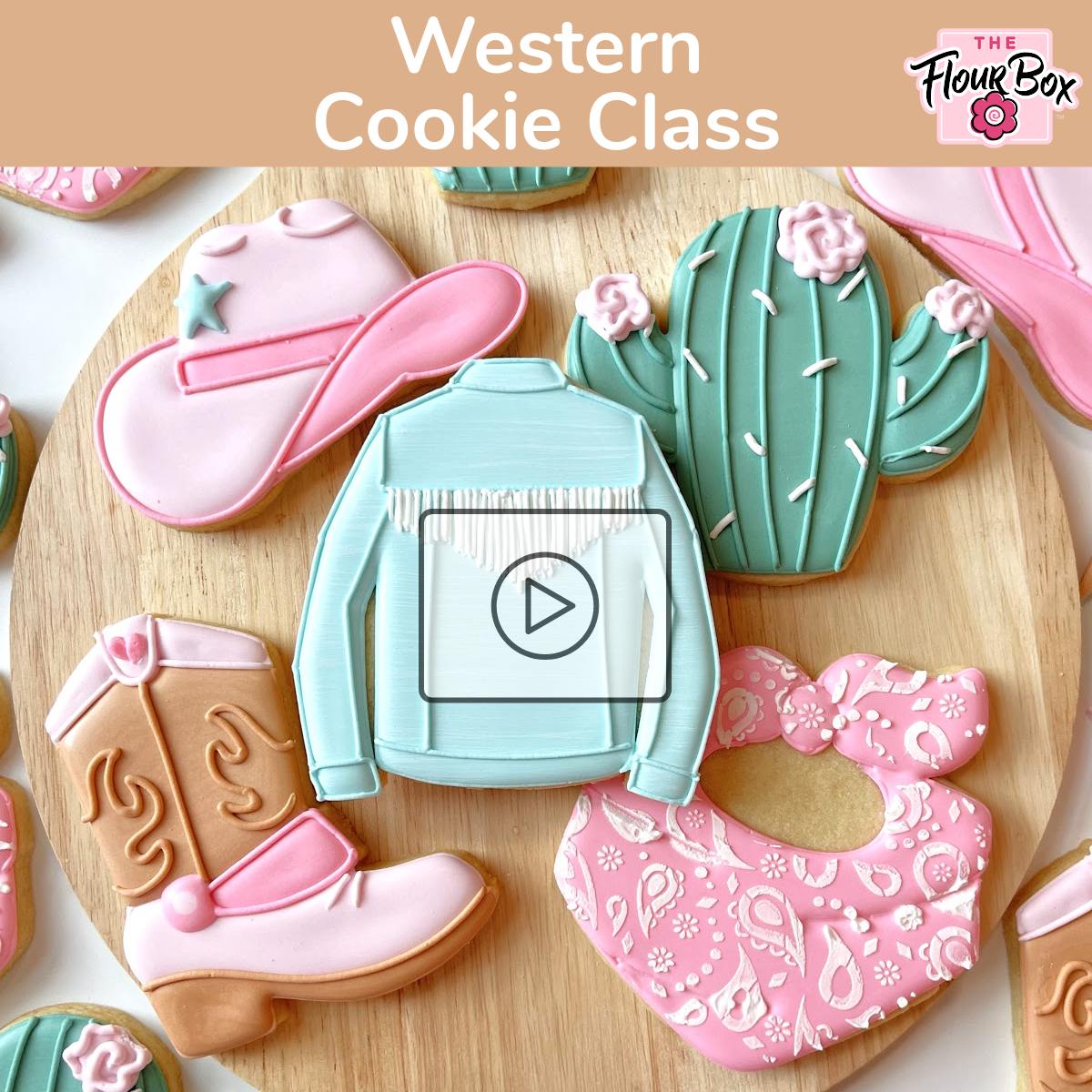 A light blue western style jacket shaped sugar cookie with white fringe detailing for decorating online class recording