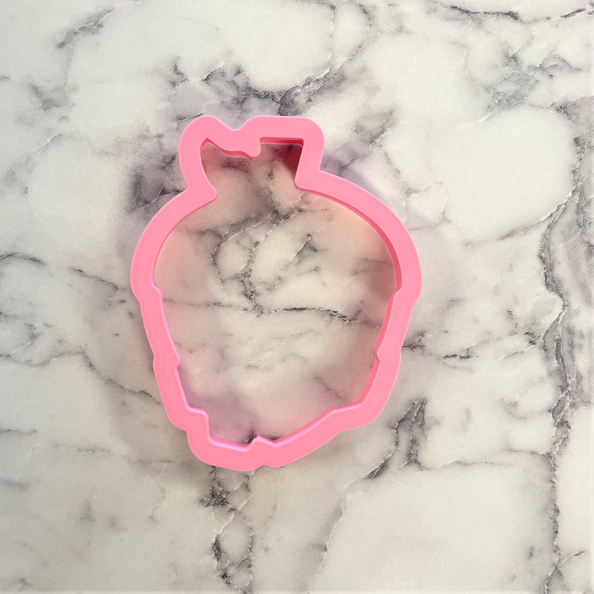 Pink plastic heart-shaped cookie cutter from acorn with scarf flour box club cookie cutter set