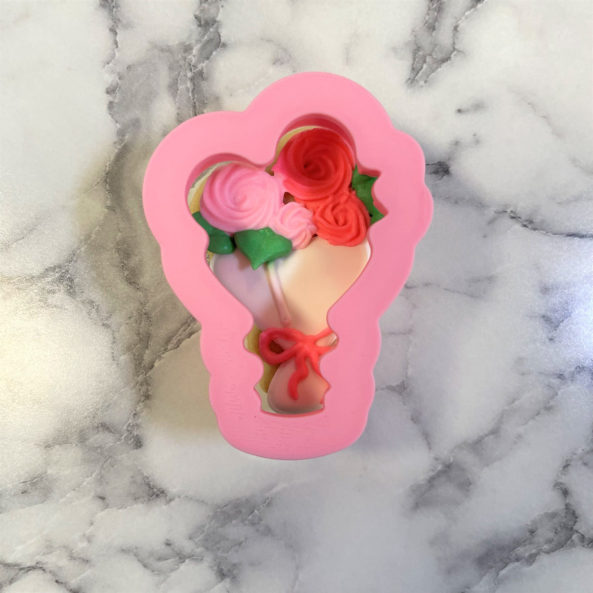 Mini flower bouquet cookie cutter pink silicone mold shaped like roses with red and pink flowers and green leaves