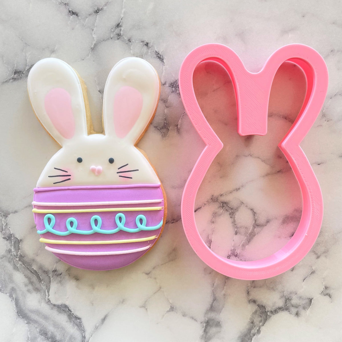 Pink bunny egg cookie cutter with smooth glossy finish designed for baking shaped cookies
