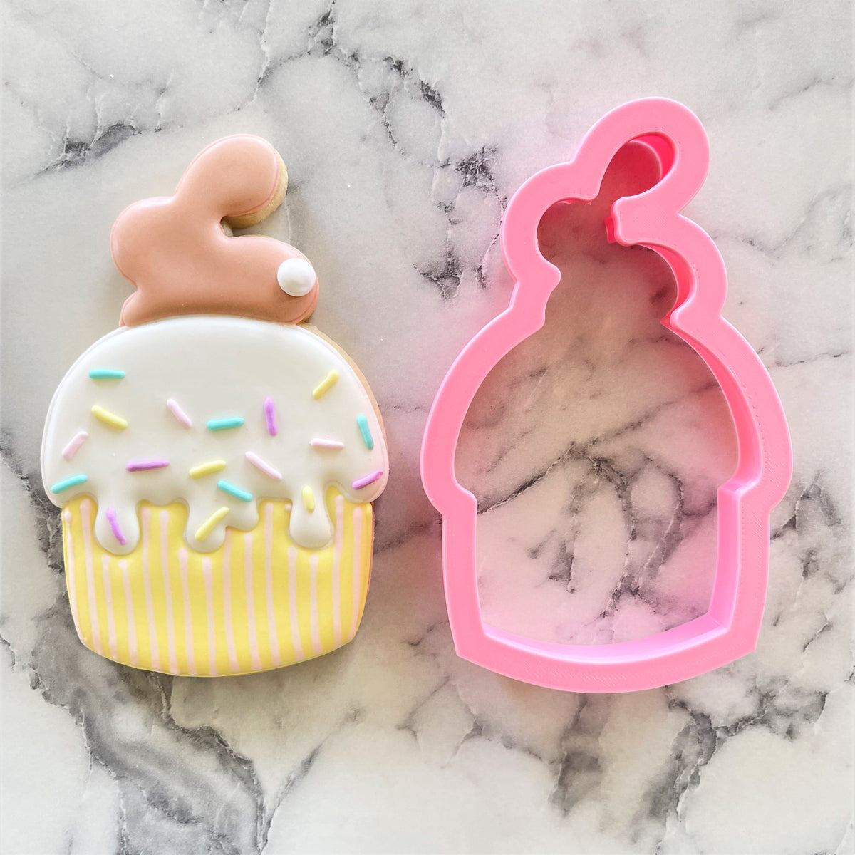 Pink silicone bunny muffin cookie cutter with bunny-shaped topper for baking and decorating cupcakes and cookies