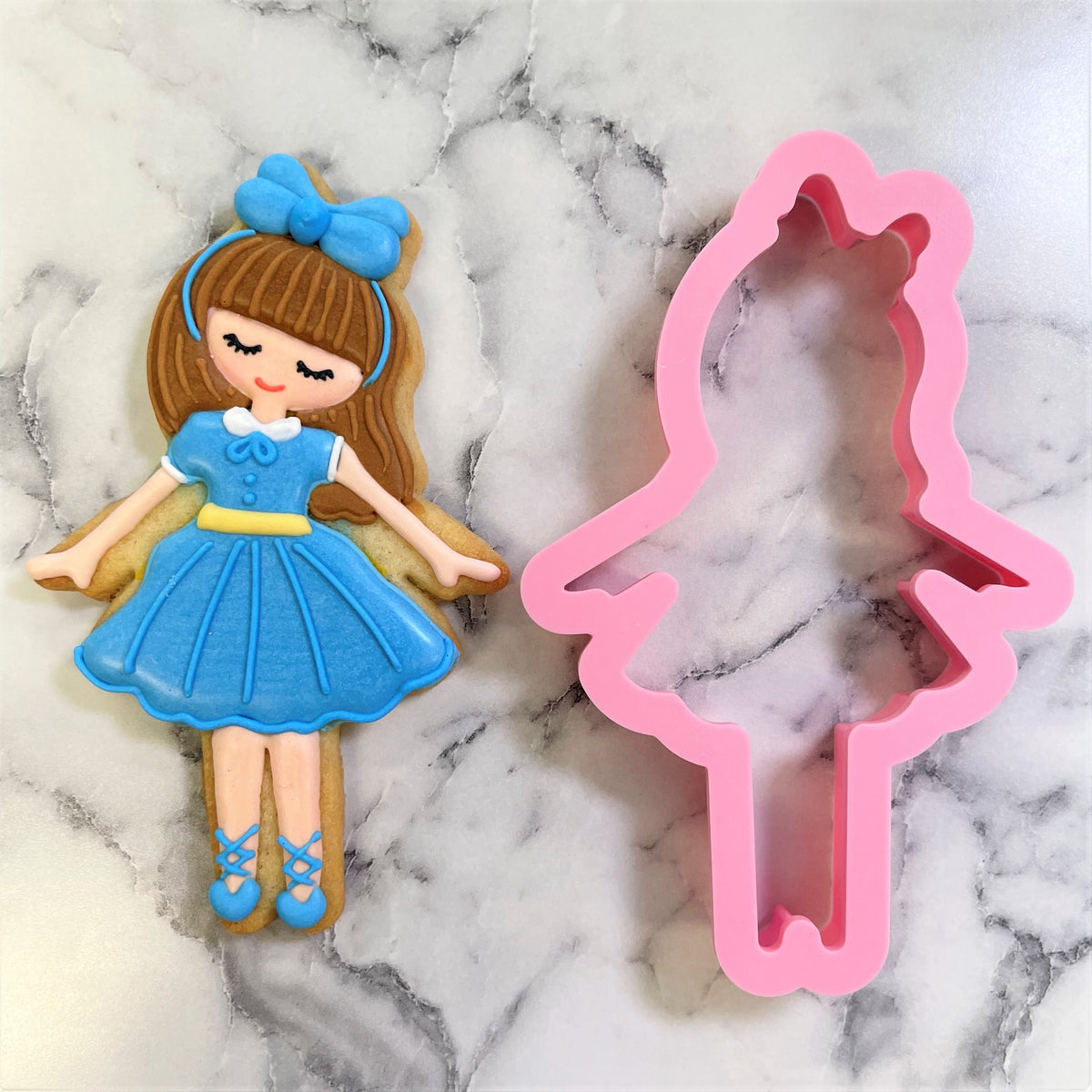 Clara cookie cutter pink silicone doll shape with long hair and dress for baking and crafting