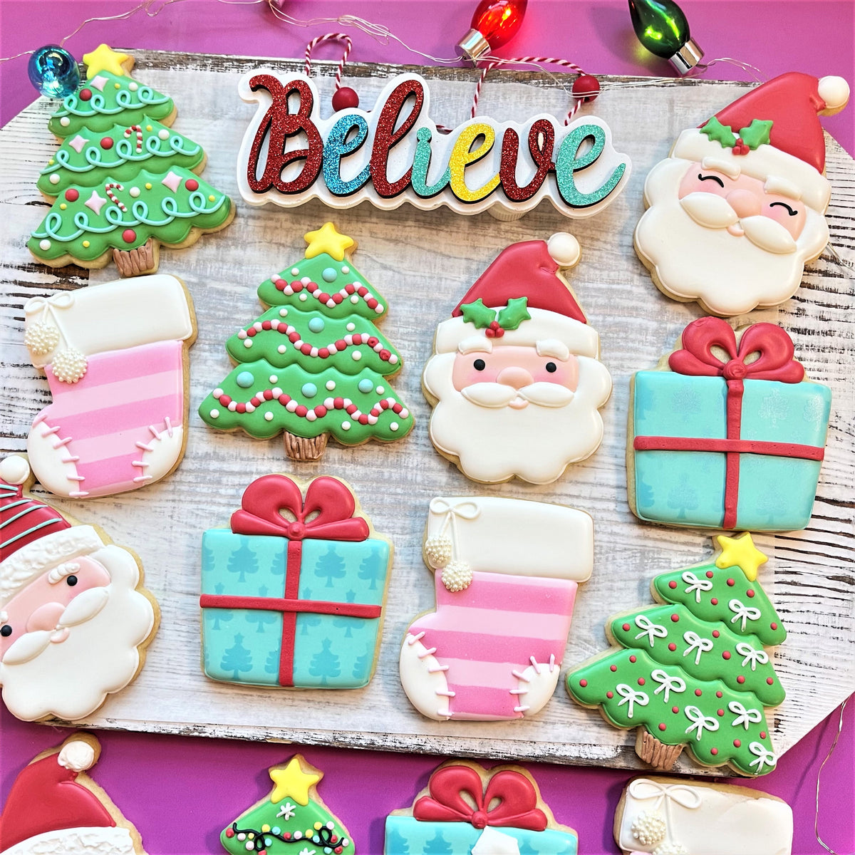 Colorful christmas-themed sugar cookies shaped like trees santa claus gifts and stockings made with classic present cookie cutter
